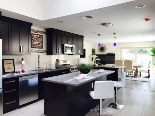 dark cabinets with light flooring