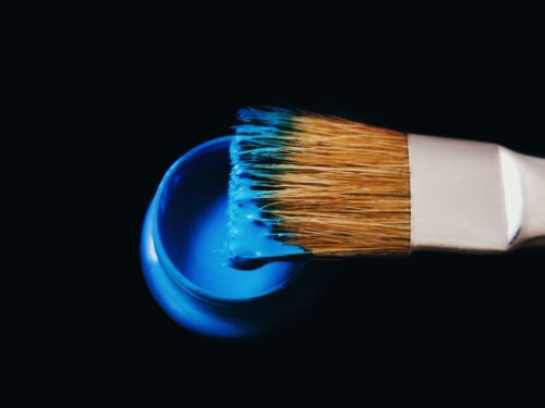 blue paint and paint brush